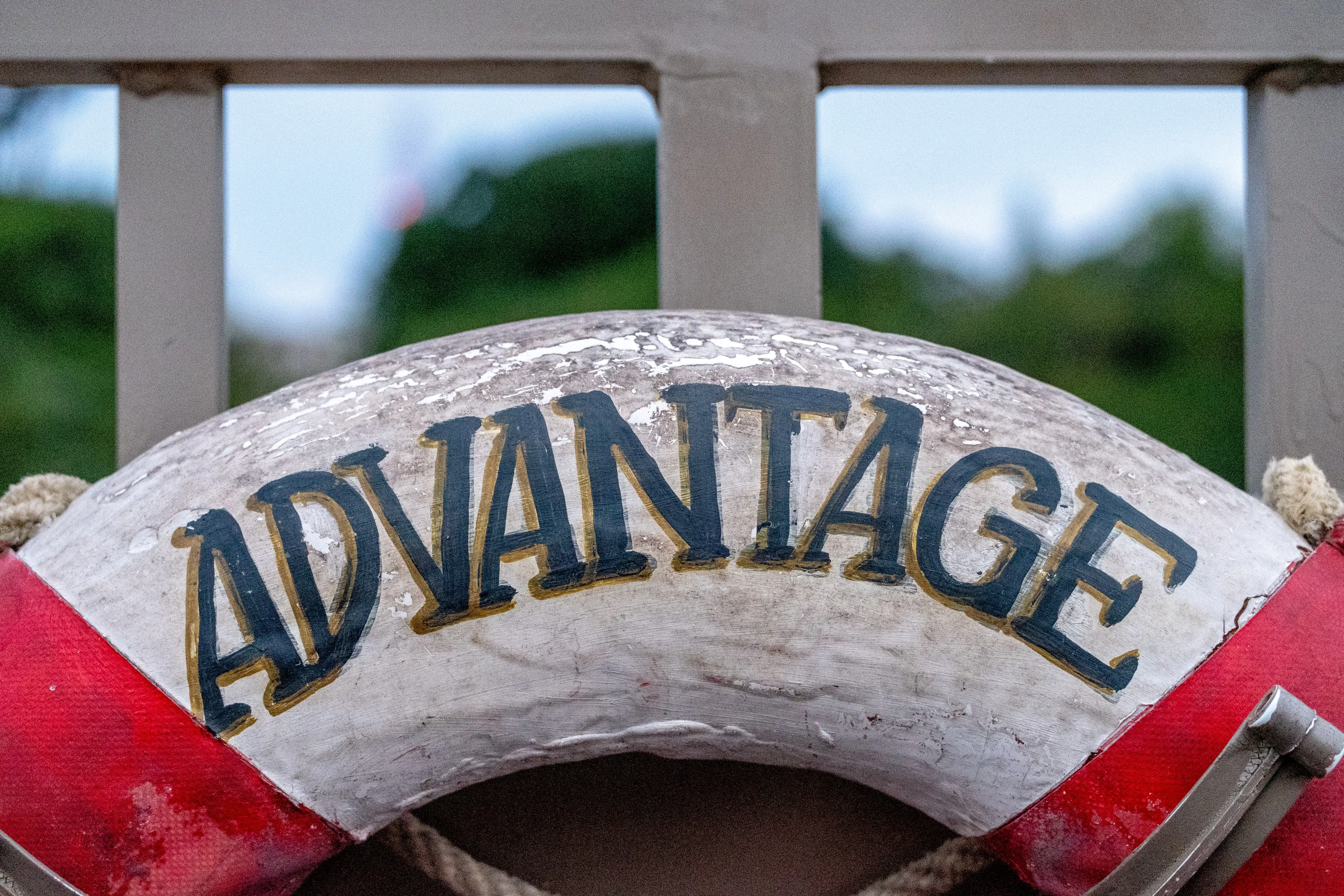 a sign showing the Advantage